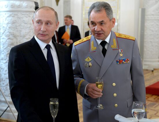 Russian President Vladimir Putin meets with service personnel who took part in counter-terrorism operation in Syria
