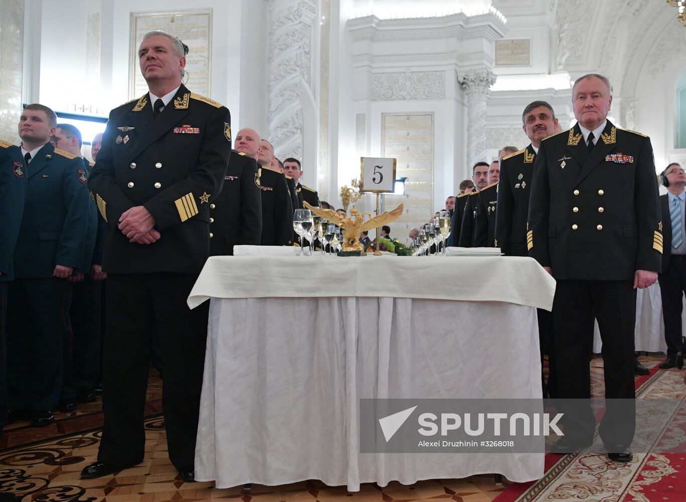 Russian President Vladimir Putin meets with service personnel who took part in counter-terrorism operation in Syria