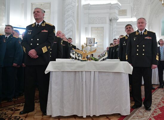Russian President Vladimir Putin meets with service personnel who took part in counter-terrorism operation in Syria