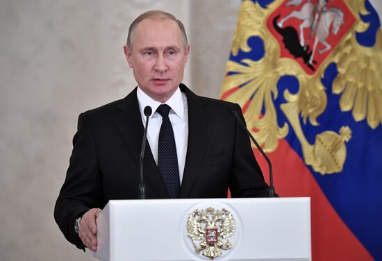Russian President Vladimir Putin meets with service personnel who took part in counter-terrorism operation in Syria