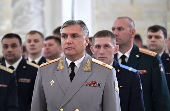 Russian President Vladimir Putin meets with service personnel who took part in counter-terrorism operation in Syria