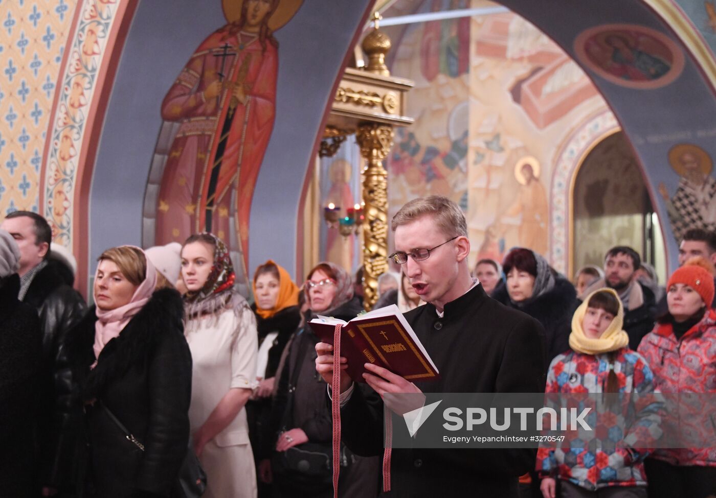A Christmas service at Epiphany Cathedral, Tomsk. Location: Russia, Tomsk. Author: Evgeny Yepanchintsev/Sputnik. Christmas celebrated across Russia