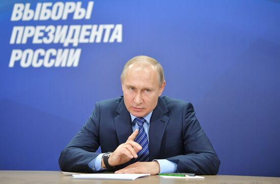 President Vladimir Putin visits his campaign headquarters in Moscow