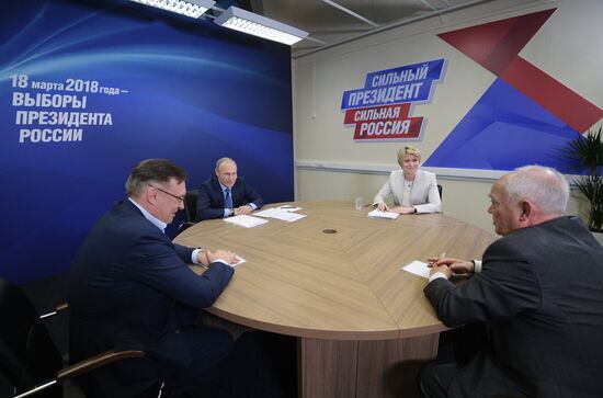 President Vladimir Putin visits his campaign headquarters in Moscow