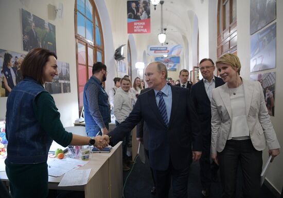 President Vladimir Putin visits his campaign headquarters in Moscow