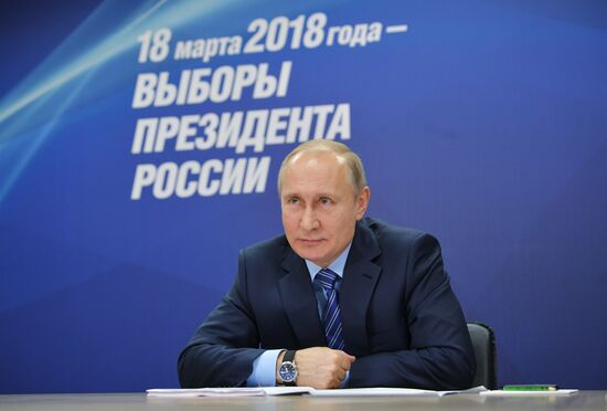 President Vladimir Putin visits his campaign headquarters in Moscow
