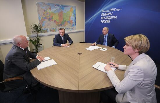 President Vladimir Putin visits his campaign headquarters in Moscow