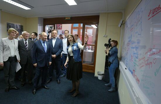President Vladimir Putin visits his campaign headquarters in Moscow