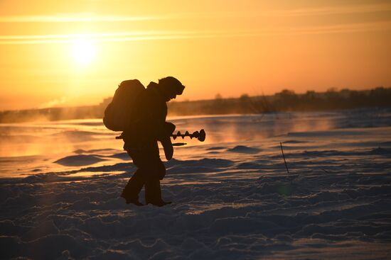 Ice fishing on Tom River