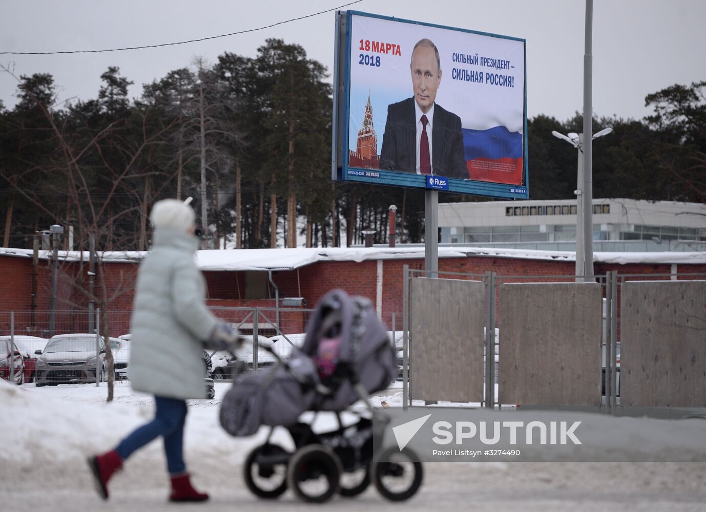 Campaign posters in support of incumbent Russian President Vladimir Putin