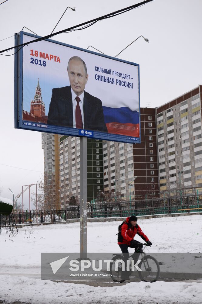 Campaign posters in support of incumbent Russian President Vladimir Putin