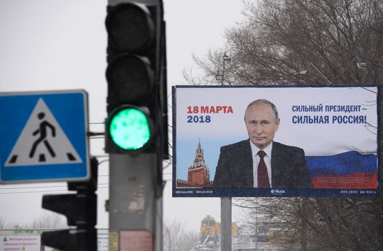Campaign posters in support of incumbent Russian President Vladimir Putin