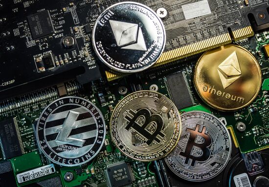 Souvenir coins with cryptocurrency logos