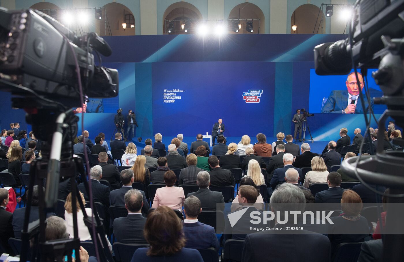 Russian presidential candidate Vladimir Putin meets with his authorized representatives