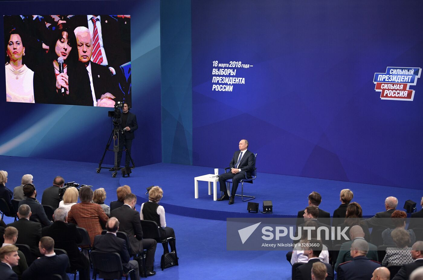 Russian presidential candidate Vladimir Putin meets with his authorized representatives