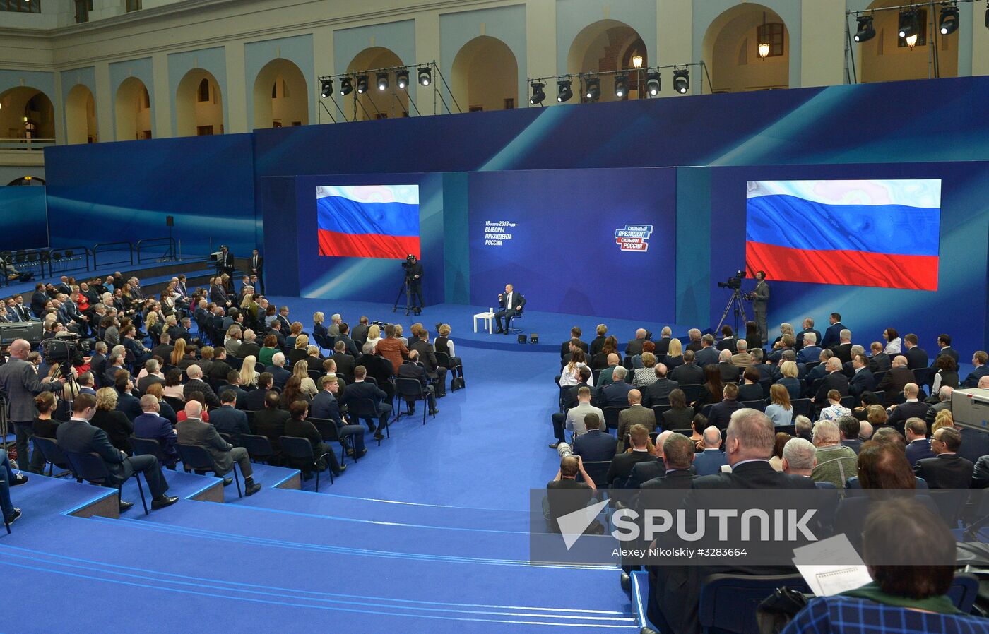 Russian presidential candidate Vladimir Putin meets with his authorized representatives