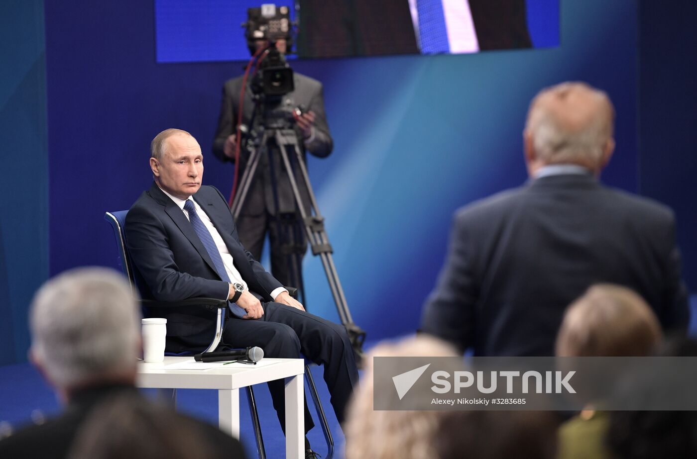 Russian presidential candidate Vladimir Putin meets with his authorized representatives