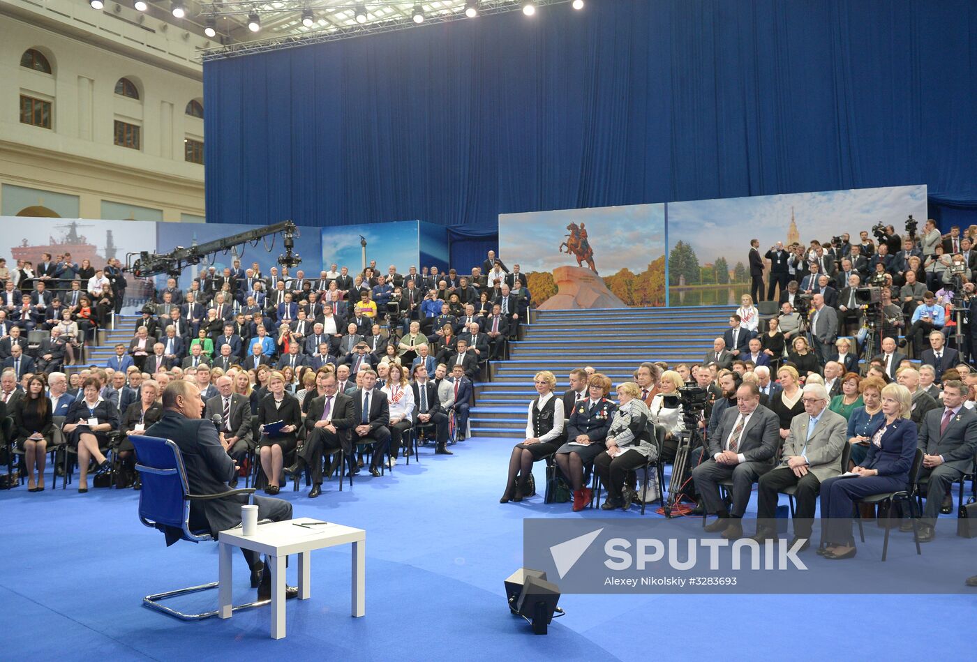 Russian presidential candidate Vladimir Putin meets with his authorized representatives