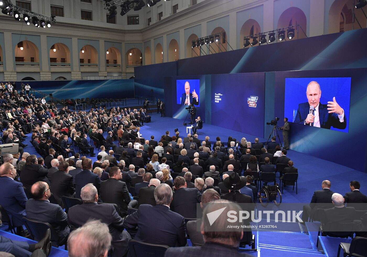 Russian presidential candidate Vladimir Putin meets with his authorized representatives