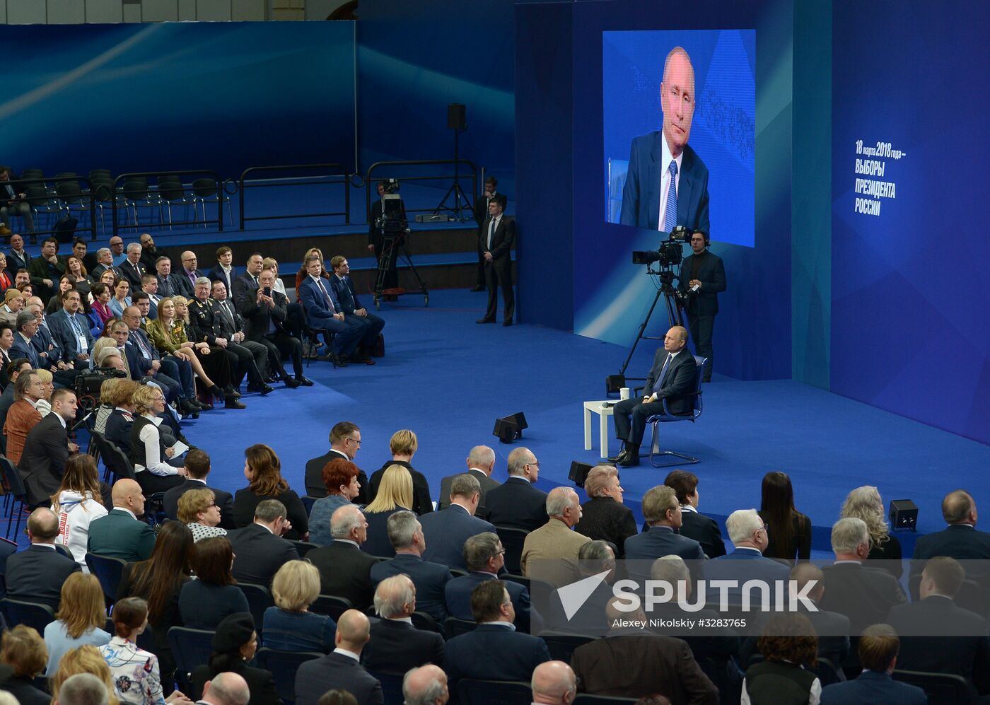 Russian presidential candidate Vladimir Putin meets with his authorized representatives