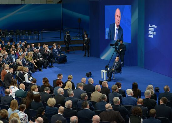 Russian presidential candidate Vladimir Putin meets with his authorized representatives