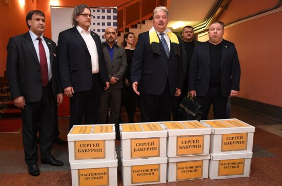Submitting signatures in support of Sergei Baburin's registration as presidential candidate