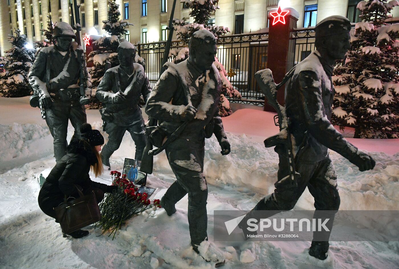 Flowers in memory of killed pilot Roman Filipov at Russian Defense Ministry