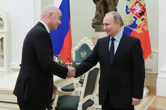 President Vladimir Putin meets with FIFA President Gianni Infantino