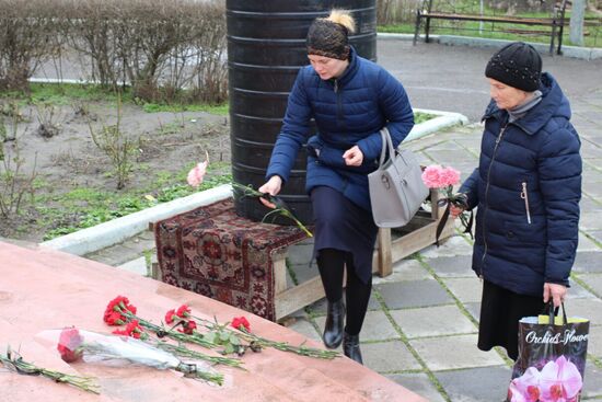 Leaving flowers outside St. George's Church in Kizlyar