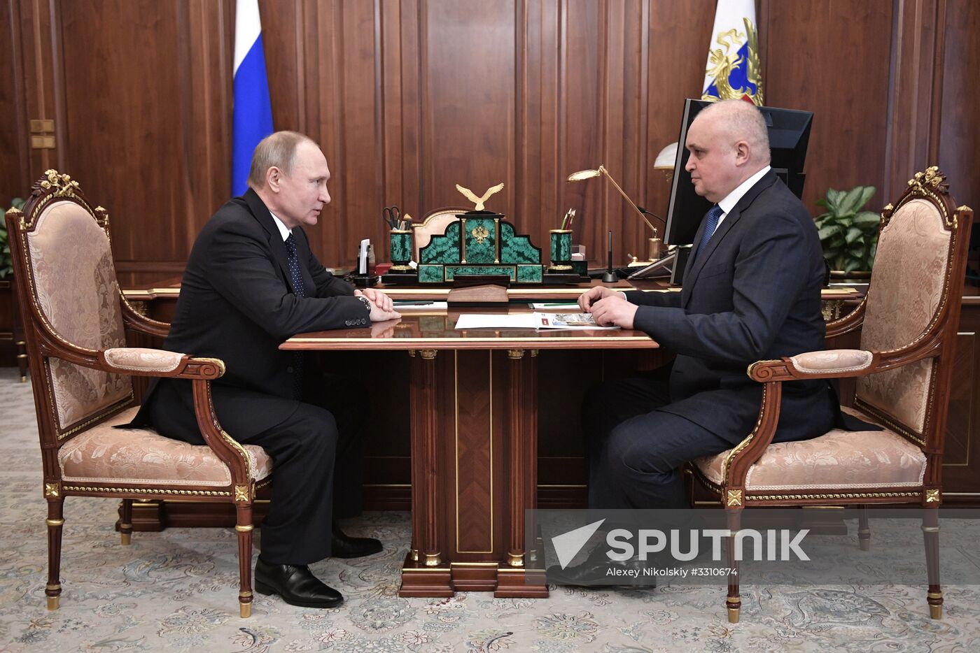 Russian President Vladimir Putin meets with Kolmar head Sergei Tsivilev