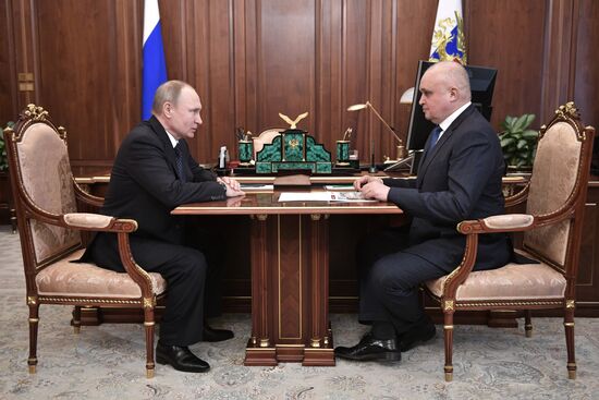 Russian President Vladimir Putin meets with Kolmar head Sergei Tsivilev