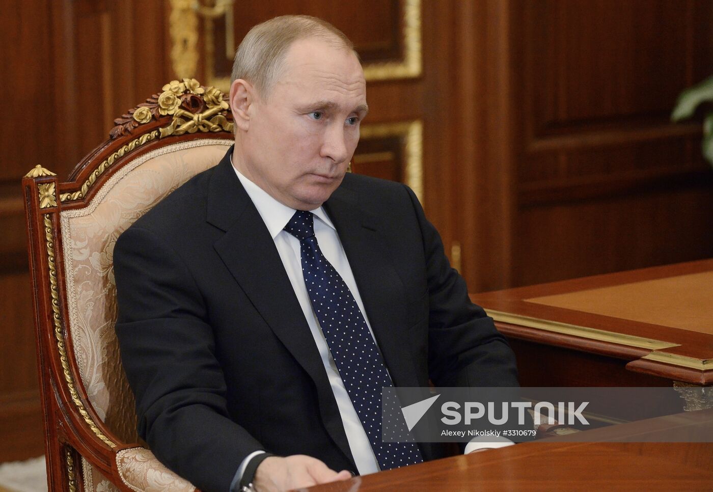 Russian President Vladimir Putin meets with Kolmar head Sergei Tsivilev