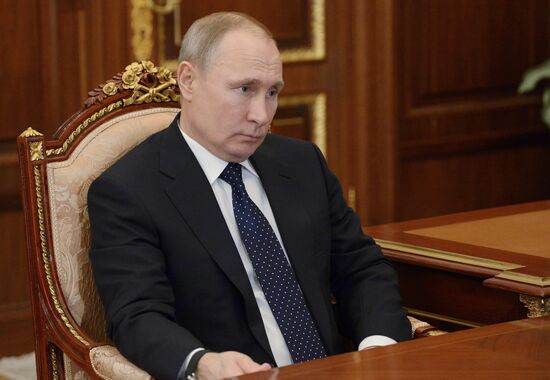 Russian President Vladimir Putin meets with Kolmar head Sergei Tsivilev
