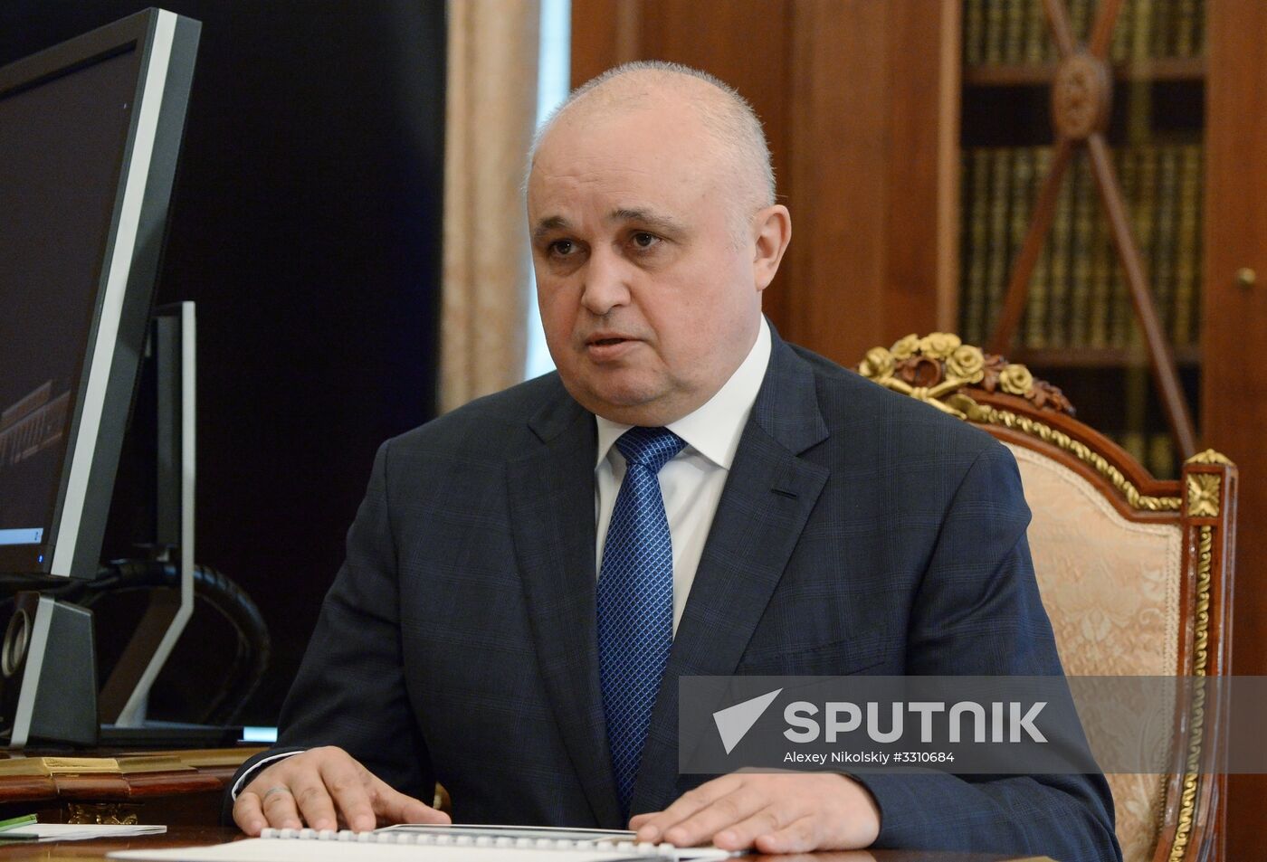 Russian President Vladimir Putin meets with Kolmar head Sergei Tsivilev