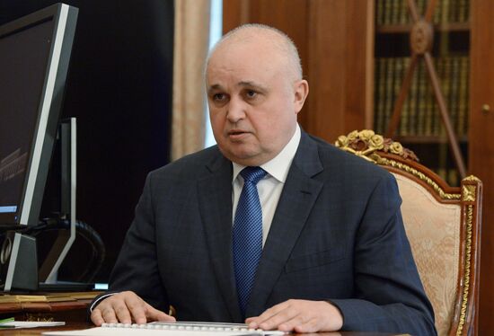 Russian President Vladimir Putin meets with Kolmar head Sergei Tsivilev