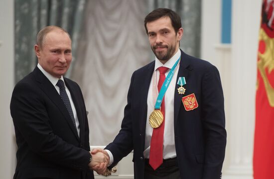 President Vladimir Putin presents state decorations to 2018 Winter Olympics medalists