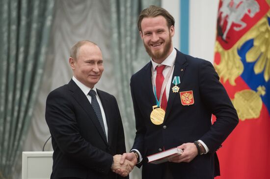 President Vladimir Putin presents state decorations to 2018 Winter Olympics medalists