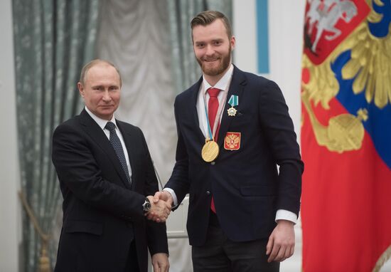 President Vladimir Putin presents state decorations to 2018 Winter Olympics medalists