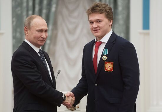 President Vladimir Putin presents state decorations to 2018 Winter Olympics medalists