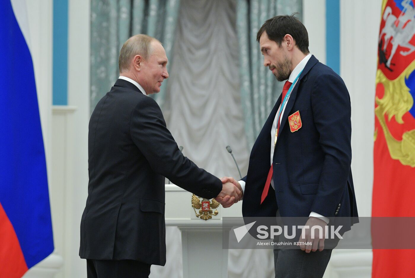 President Vladimir Putin presents state decorations to 2018 Winter Olympics medalists