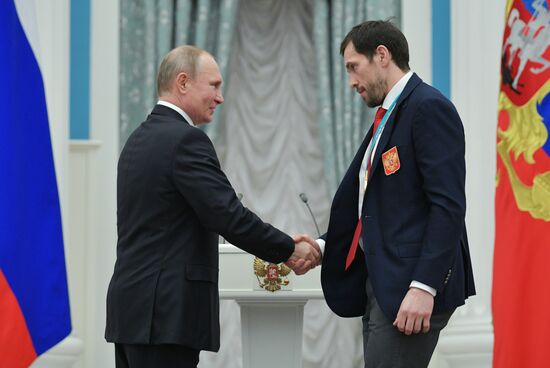 President Vladimir Putin presents state decorations to 2018 Winter Olympics medalists