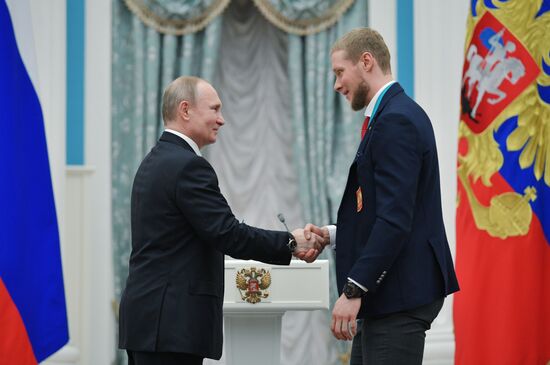 President Vladimir Putin presents state decorations to 2018 Winter Olympics medalists
