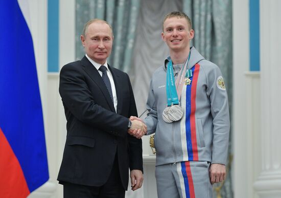 President Vladimir Putin presents state decorations to 2018 Winter Olympics medalists