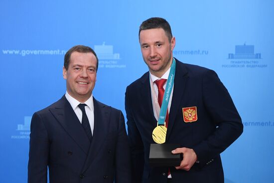 Prime Minister Dmitry Medvedev presents cars to 2018 Winter Olympics medalists at ceremony