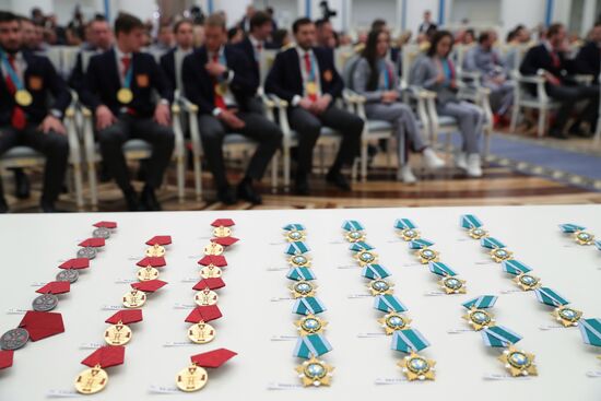 President Vladimir Putin presents state decorations to 2018 Winter Olympics medalists