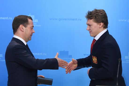 Prime Minister Dmitry Medvedev presents cars to 2018 Winter Olympics medalists at ceremony