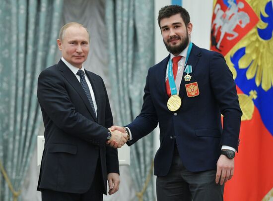President Vladimir Putin presents state decorations to 2018 Winter Olympics medalists