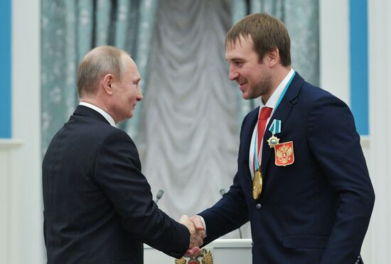 President Vladimir Putin presents state decorations to 2018 Winter Olympics medalists
