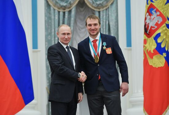 President Vladimir Putin presents state decorations to 2018 Winter Olympics medalists