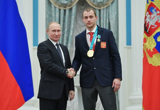 President Vladimir Putin presents state decorations to 2018 Winter Olympics medalists
